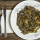 Plate of Collard Greens on wooden table